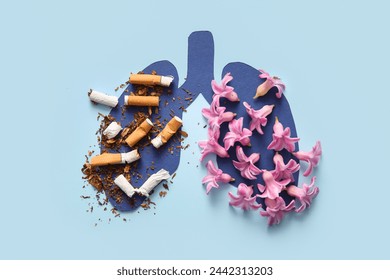 青の背景に紙の肺と花とタバコの吸い殻、接写。禁煙コンセプト。の写真素材