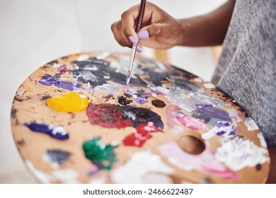 Person, hands and art with palette in closeup for painting project, creative expression and hobby at home. Painter, artwork and color mixing with brush and sustainable materials for inspiration स्टॉक फ़ोटो