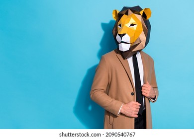 Photo of eccentric weird guy in lion mask look good virile empty space isolated over blue color background 库存照片