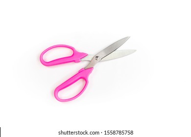 Pink scissors on a white background .の写真素材
