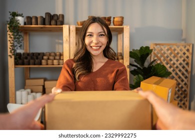 Portrait of young woman receive box form deliverly man in store house. Beautiful attractive business girl working to getting parcel boxes ecommerce shipping online from postman deliver at home shop. – Ảnh có sẵn