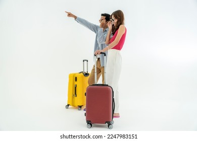 Portrait of an Asian couple with their suitcases, passports and travel tickets. isolated on a white background Arkivfotografi