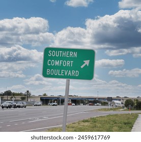 Road Sign with Directional Arrow: Southern Comfort Boulevard  ภาพถ่ายสต็อก