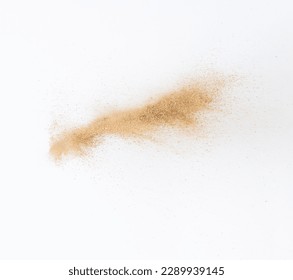 Sand flying explosion, Golden sand wave explode. Abstract sands cloud fly. Yellow colored sand splash throwing in Air. White background Isolated high speed shutter, throwing freeze stop motion Foto stock