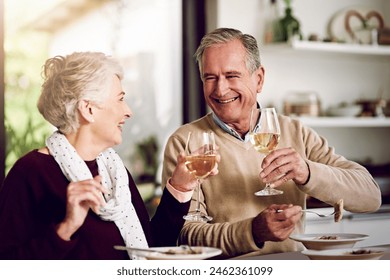 Senior couple, dinner and laughing in home for anniversary, date or retirement with love in marriage. Elderly, people and eating together with wine and happy for romance, relationship or bonding Stockfoto