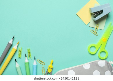 Set of school supplies on turquoise background. Top view Stock Photo