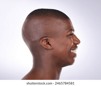 Skincare, smile and profile of black man in studio for dermatology, treatment and wellness. Happy, male person and pride with confidence on white background for cosmetics, self care and satisfaction Stockfotó