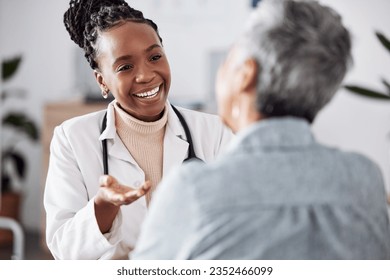 Smile, black woman or doctor consulting a patient in meeting in hospital for healthcare feedback or support. Happy, medical or nurse with a mature person talking or speaking of test results or advice Stockfoto