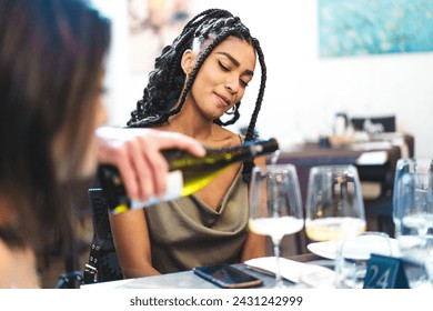 Smiling woman savoring a wine tasting experience - Indulgence and relaxation at an elegant dinner setting. – Ảnh có sẵn