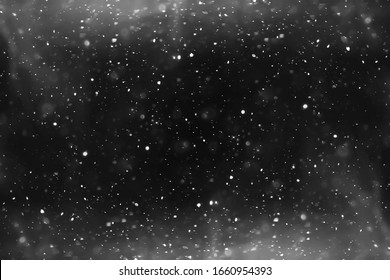 snow black background abstract texture, snowflakes falling in the sky overlay Stock Photo