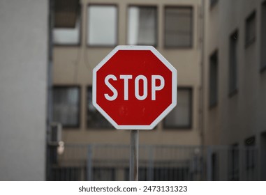 Stop sign, in the background of a residential building – Ảnh có sẵn