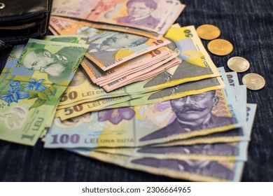 Stack of romanian polymer banknotes and coins,romanian RON currency,selective focus Arkivfotografi