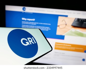 Stuttgart, Germany - 07-11-2023: Smartphone with logo of the Global Reporting Initiative (GRI) on screen in front of website. Focus on center-right of phone display. Unmodified photo. Adlı Haber Amaçlı Stok Fotoğraf