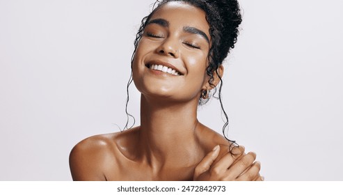 Studio, shine and joy of woman, beauty and treatment of skincare, soft and glow of body in results. Pink background, aesthetic and proud for skin, dermatology and cosmetics for person and hand: stockfoto