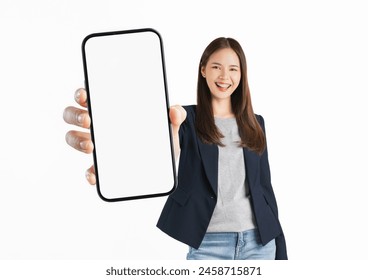 Studio shot of Beautiful Asian woman holding smartphone mockup of blank screen and smiling on white background. Arkistovalokuva