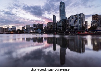 Стоковая фотография: Stunning reflection of the Melbourne Central Business district skyline during sunset in the water of the Yarra river in Victoria state and second largest city in Australia