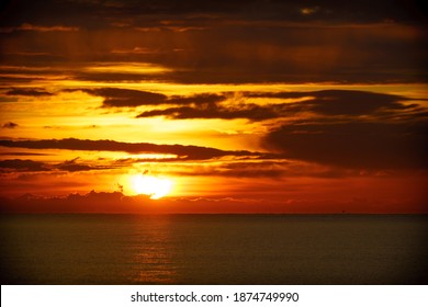 Sunrise over sea. Sun rising above horizon. Stock Photo