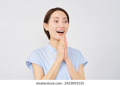 Surprised Asian woman in white background Foto Stock