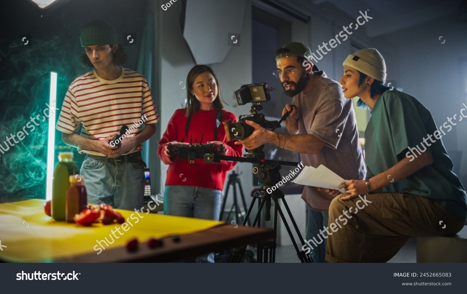 Diverse Young Film Crew Engaged In A Creative Video Production Session On A Vibrant Set, Surrounded By Modern Equipment And Colorful Props, Focusing On Capturing Engaging Content For A Dynamic Project