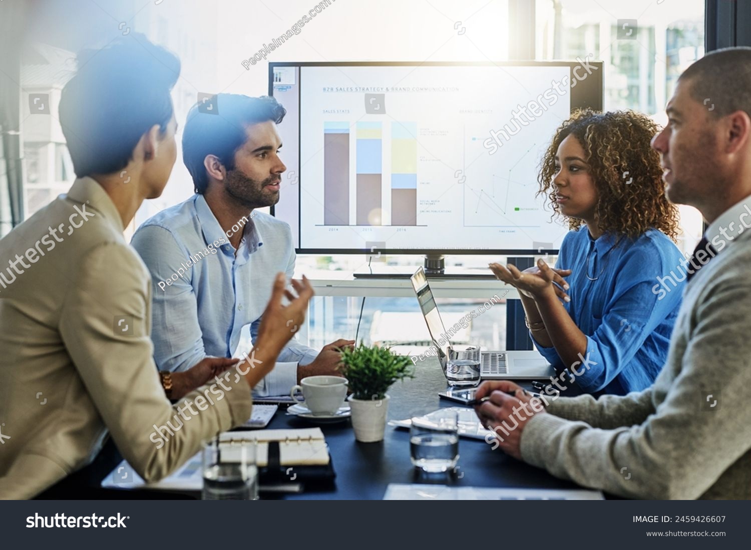 Business people, screen and discussion with team in meeting, presentation or conference at office. Group of employees with finance graph, chart or data in collaboration, company investment or revenue