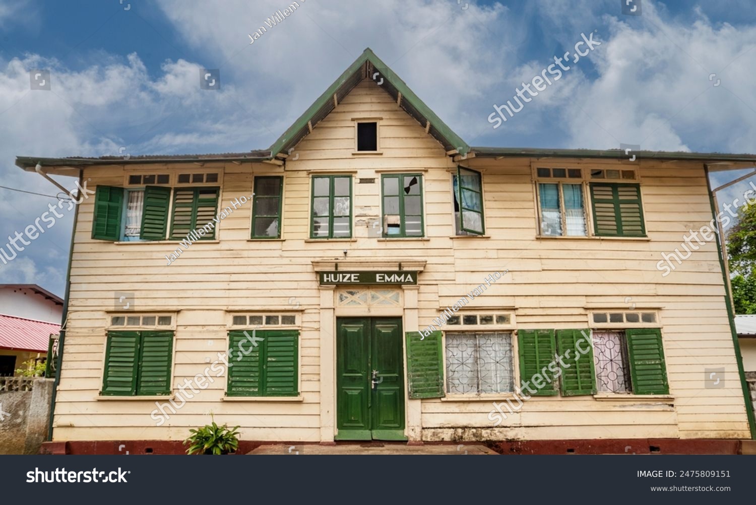 Facade of an old white wooden house with the name 'Huize Emma' (translation: Emma House) , historical center of Paramaribo, Suriname, South America