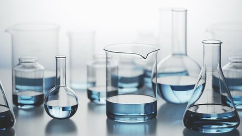 Versatile laboratory glassware with blue liquid inside on a light background. Many different kinds of chemistry containers stacked in an endless, seamless looping pattern. Camera moving sideways.
 库存视频