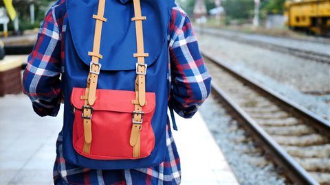 Back side of Senior man Asian with backpack are walking at train station. Travel, Tourist, holiday and lifestyle Concept Stock Video