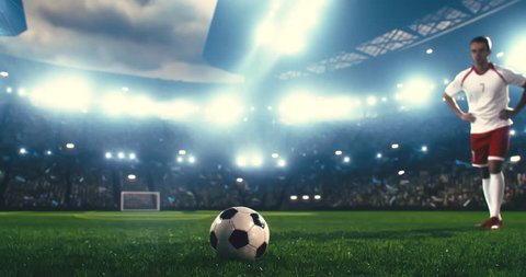 4k footage of a soccer player in dramatic play during a soccer game on a professional outdoor soccer stadium. Players wear unbranded uniform. Stadium and crowd are made in 3D.の動画素材