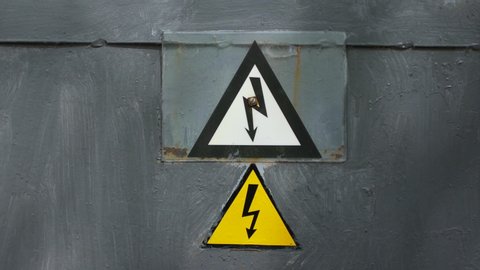 Warning sign on the danger of electricity. Sign on the fence of the power plant Video stock