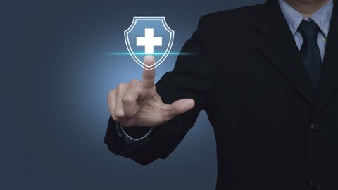 Businessman pressing cross shape with shield flat icon over light blue background, Business healthy and medical care insurance concept Stock-video