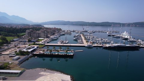 Porto Montenegro, Tivat. Aerial View of Marina, Yachts, Sailboat, Swimming Pool and Luxury Apartment Buildings, Drone Shotの動画素材