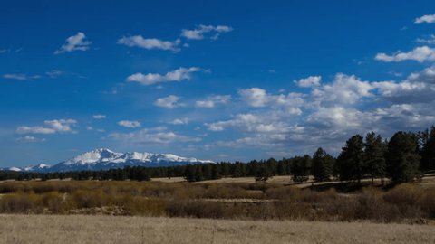 Panning Time Lapse Shot Of Beautiful Landscape Near Snowcapped Mountains Against Sky - Flagstaff, Arizona: stockvideo