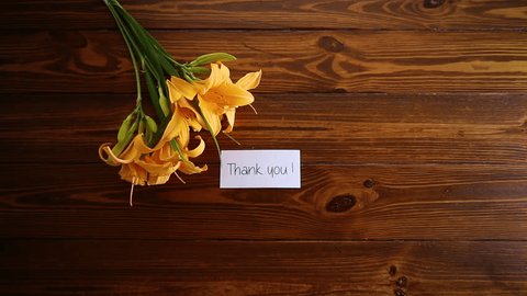 bouquet of beautiful yellow lilies on wooden table स्टॉक व्हिडिओ