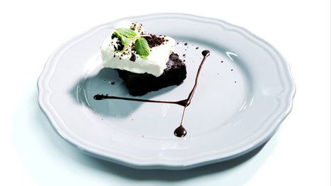 Chocolate brownie with ice cream on light background Stock-video