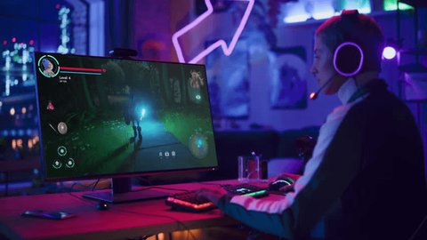 Professional Female Gamer Intensely Playing an Online RPG Video Game at Home, Captured in a Vivid, Modern Gaming Setup that Highlights Dynamic and Immersive World of Esports and Online Tournaments: stockvideo
