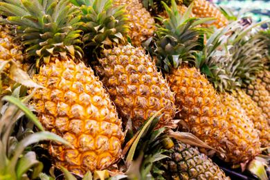 pile of pineapples at the grocery store