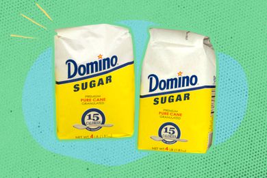 domino sugar packets on a blue and green illustrated background