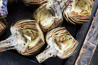 Grilled artichokes on a baking sheet