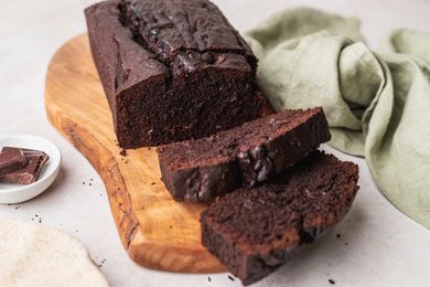 Chocolate pound cake on wooden board.