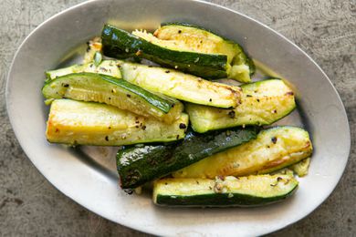 Roasted Zucchini with garlic and black pepper on a serving platter