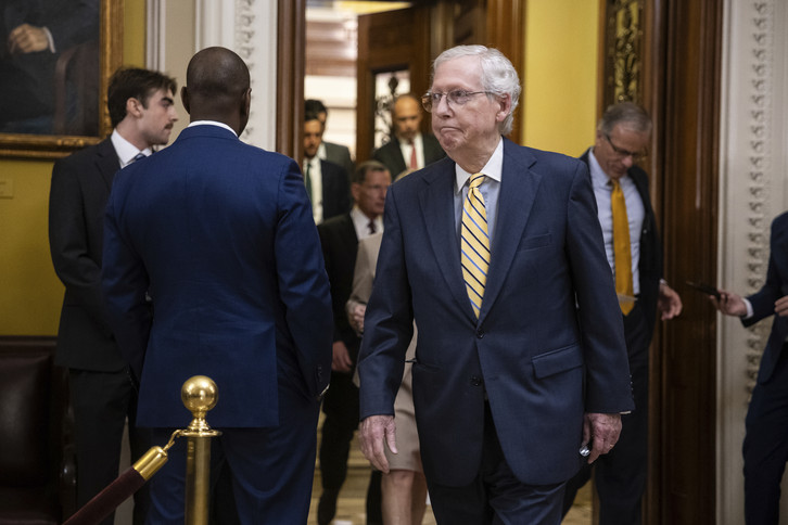Senate Minority Leader Mitch McConnell arrives for a press conference.