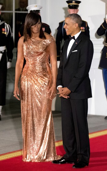 President Barack Obama and first lady Michelle Obama wait at the White House for the Italian Prime Minister