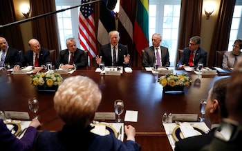 Donald Trump sits across from Lithuanian President Dalia Grybauskaite, Estonian President Kersti Kaljulaid, and Latvian President Raimonds Vejonis at a meeting on Tuesday