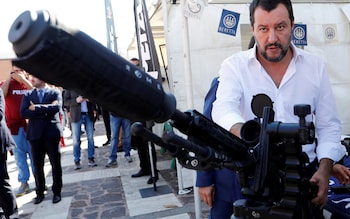  Italian Deputy Prime Minister and Interior Minister Matteo Salvini stands next to a sniper rifle during an event involving the state police SWAT team in Rome