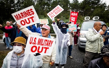 Anti U.S. Base protesters in Okinwawa - Japan condemns 'intolerable' US army after soldier charged with rape of teenager