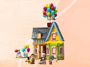 The Lego Disney and Pixar ‘Up’ House Set on a peach patterned background.