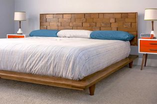 A wooden bed in a bedroom