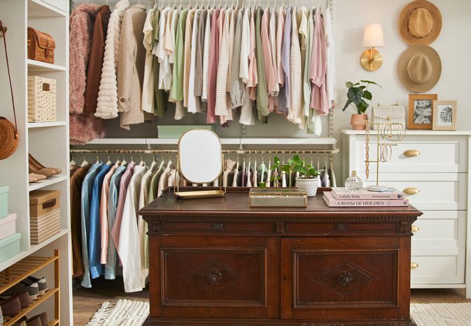 Vintage dresser being used as an island in a walk-in closet