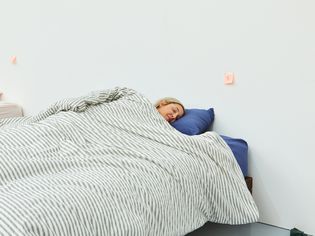 Person sleeping in a bed made with a JELLYMONI 100% Natural Cotton 3pcs Striped Duvet Cover Set