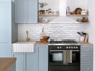 light small blue kitchen with white subway tiles